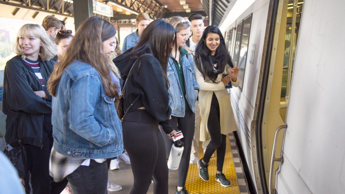 People boarding a train